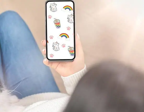 woman holding a phone - cat wallpaper